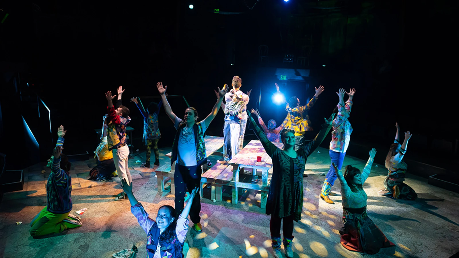 Group of singers with hands up