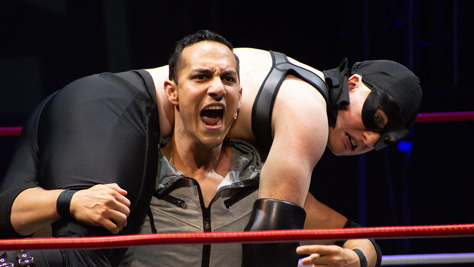 Wrestler with another wrestler on their back.