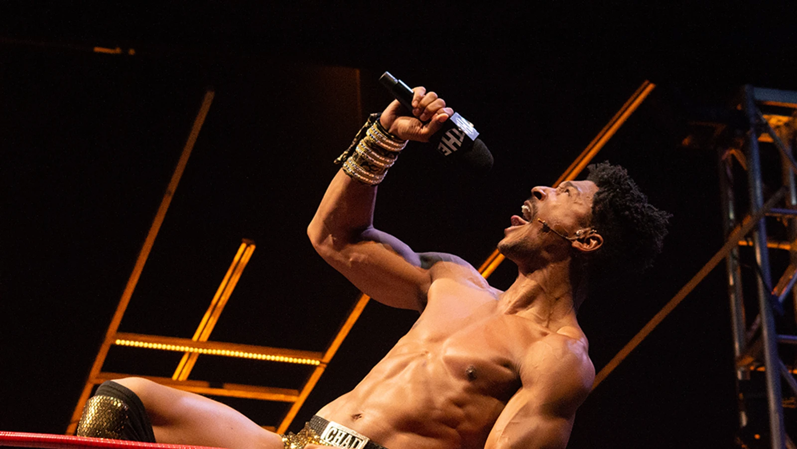 Wrestler Yelling into Mic
